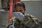 Image of an Airman drawing a vaccine.