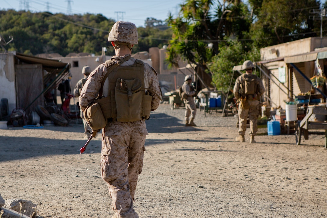 U.S. Marines with 1st Intelligence Battalion, I Marine Expeditionary Force Information Group, conduct patrols during a CounterIntelligence and Human Intelligence Tactical Exercise  at Marine Corps Base Camp Pendleton, California, Oct. 16, 2020. The CI/HUMINT TACEX integrates infantry and intelligence Marines to improve proficiency and readiness when deployed.. (U.S. Marine Corps photo by Lance Cpl. Ian M. Simmons)