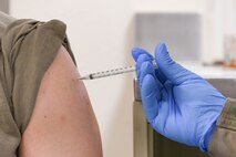 Service member receives COVID 19 vaccine