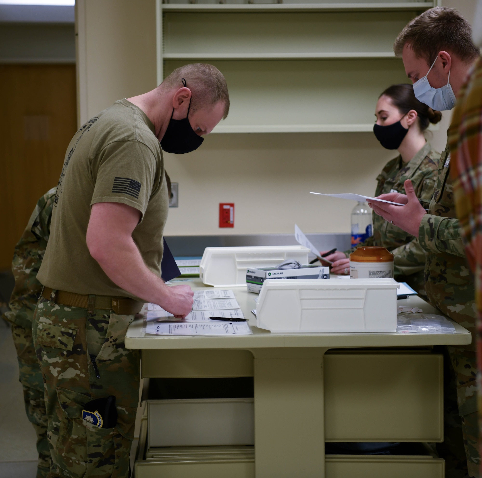 Service member receives COVID 19 vaccine