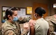 Airmen from the 2nd Medical Group receive the first doses of the COVID-19 vaccination at Barksdale Air Force Base, La., Jan. 6, 2021. The distribution of the COVID-19 vaccine is phase driven to safely protect Department of Defense personnel from COVID-19 as quickly as possible. (U.S. Air Force photo by Senior Airman Christina Graves)