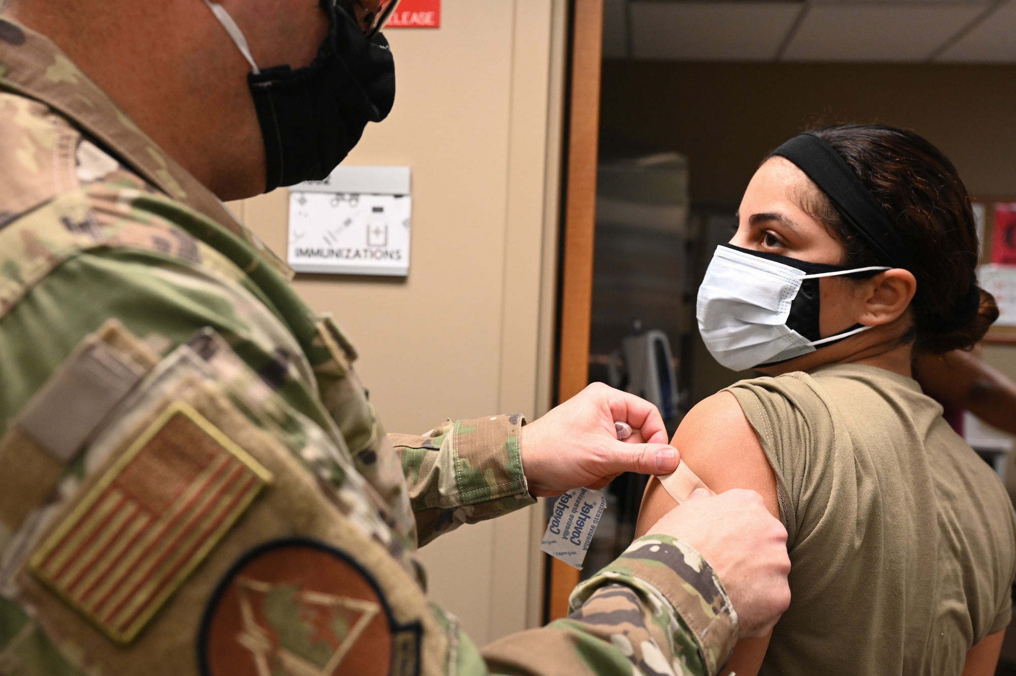 Airmen from the 2nd Medical Group receive the first doses of the COVID-19 vaccination at Barksdale Air Force Base, La., Jan. 6, 2021. Vaccines authorized for emergency use (EUA) are offered on a voluntary basis. (U.S. Air Force photo by Senior Airman Christina Graves)