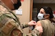 Airmen from the 2nd Medical Group receive the first doses of the COVID-19 vaccination at Barksdale Air Force Base, La., Jan. 6, 2021. Vaccines authorized for emergency use (EUA) are offered on a voluntary basis. (U.S. Air Force photo by Senior Airman Christina Graves)