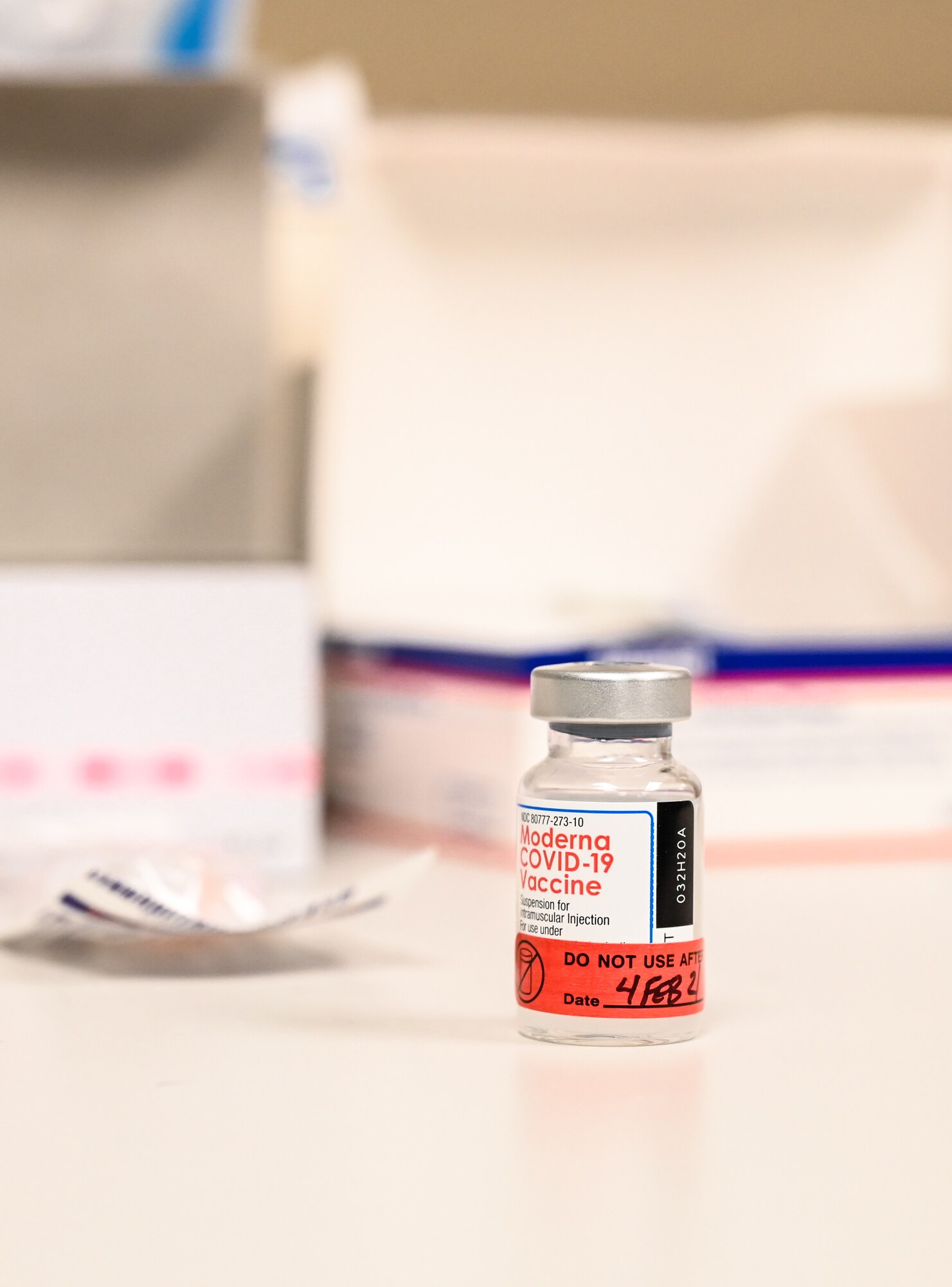 A Moderna COVID-19 vaccination sits on a table before being administered to members of the 2nd Medical Group at Barksdale Air Force Base, La., Jan. 6, 2021. The Department of Defense is dedicated to providing the latest information about the vaccines available as they are released so that DoD personnel and TRICARE beneficiaries can make informed decisions. (U.S. Air Force photo by Senior Airman Christina Graves)