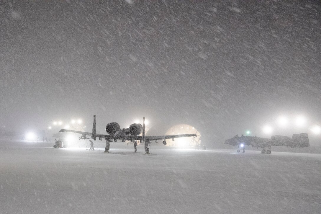 Snowfall covers A-10 Thunderbolt II’s assigned to the 25th Fighter Squadron at Osan Air Base, Republic of Korea, Jan. 6, 2021. Osan’s A-10 unit, the 25th Fighter Squadron Assam Draggins, operates as a premier close air support fighter squadron on the Korean Peninsula. (U.S. Air Force photo by Senior Airman Noah Sudolcan.)