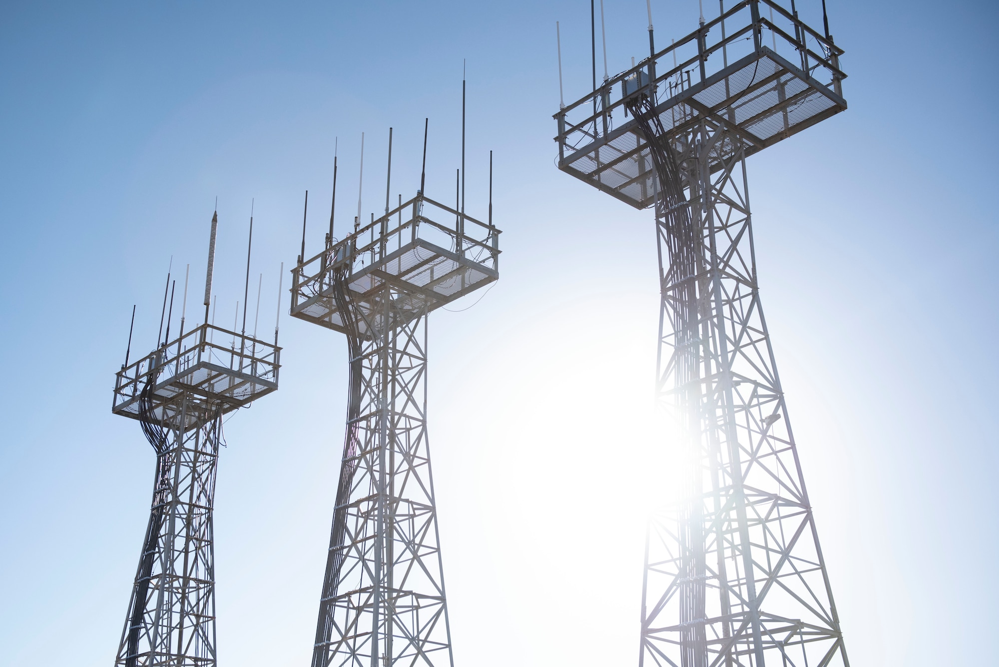 Three air traffic control and landing system (ATCALS) towers stand, undisturbed, at Laughlin Air Force Base, Texas, on Jan. 7, 2021. ATCALS towers are used for communication between pilots in the air and  air traffic controllers to discuss landing information. (U.S. Air Force photo by Airman 1st Class David Phaff)