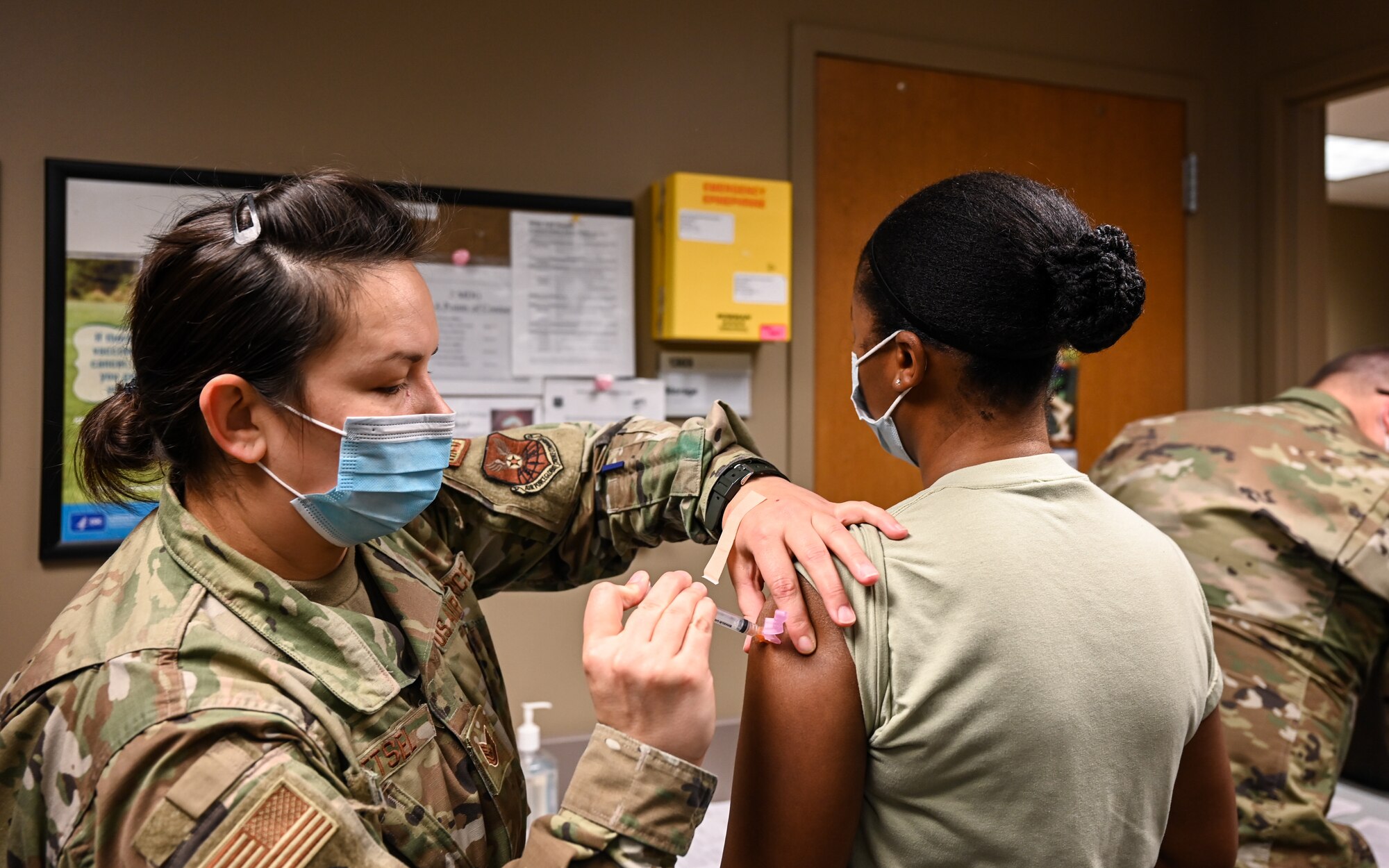 Airmen from the 2nd Medical Group receive the first doses of the COVID-19 vaccination at Barksdale Air Force Base, La., Jan. 6, 2021. The distribution of the COVID-19 vaccine is phase driven to safely protect Department of Defense personnel from COVID-19 as quickly as possible. (U.S. Air Force photo by Senior Airman Christina Graves)