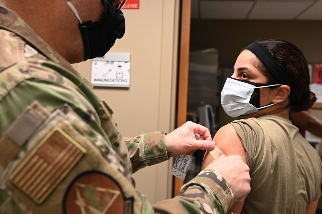 Airmen from the 2nd Medical Group receive the first doses of the COVID-19 vaccination at Barksdale Air Force Base, La., Jan. 6, 2021. Vaccines authorized for emergency use (EUA) are offered on a voluntary basis. (U.S. Air Force photo by Senior Airman Christina Graves)