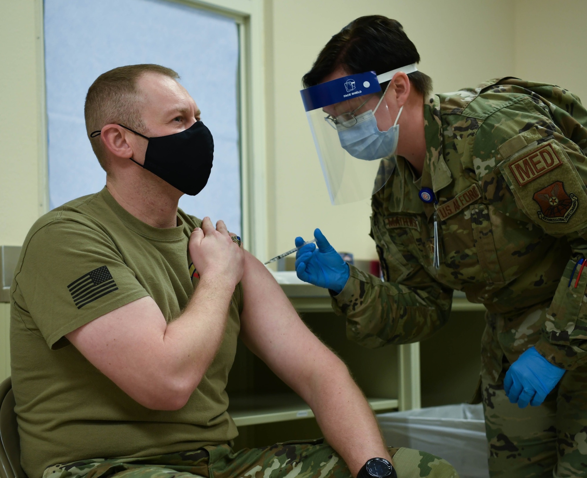 Service member receives COVID 19 vaccine