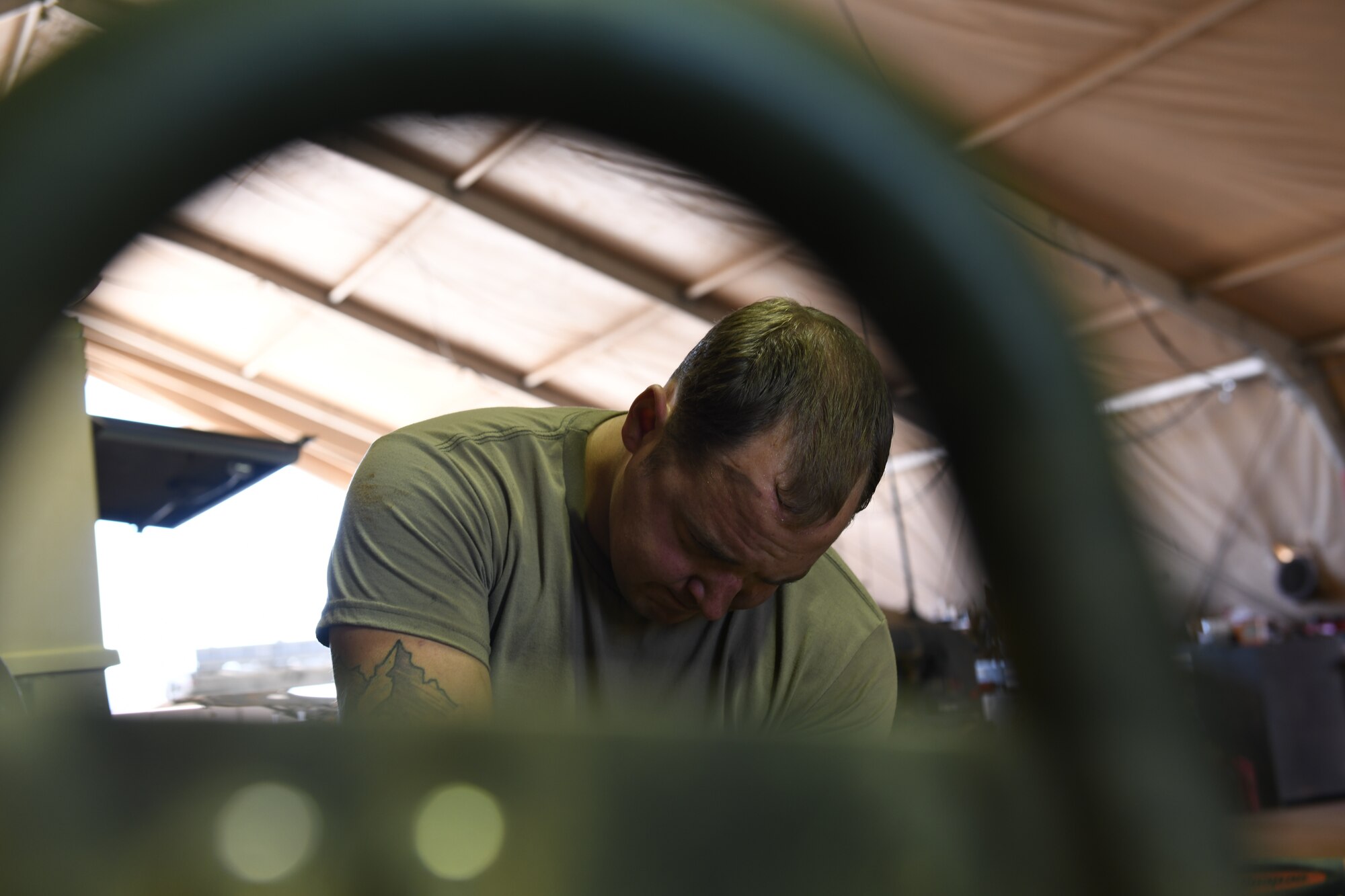 U.S. Air Force Staff Sgt. Jordan Arndt, 724th Expeditionary Air Base Squadron Logistics Readiness Flight heavy vehicle mechanic, services a Humvee at Nigerien Air Base 201, Agadez, Niger, Jan. 4, 2021. Vehicle Maintenance performs regular maintenance on government owned vehicles and equipment around the base. (U.S. Air Force photo by Senior Airman Gabrielle Winn)