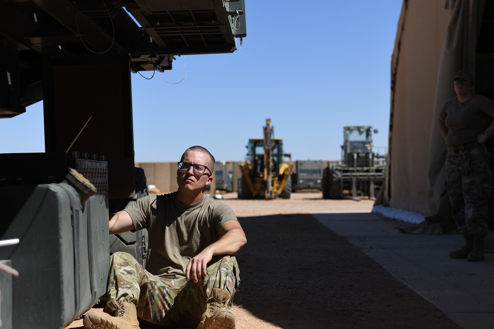 U.S. Air Force Senior Airman Ryan Davis, 724th Expeditionary Air Base Squadron air terminal operations center journeyman, tests a Halvorsen 25K-Loader to ensure that it is operational and ready for use, at Nigerien Air Base 201, Agadez, Niger, Jan 4, 2021. ATOC is responsible for the upload and download of cargo and passengers on all Air Mobility Command cargo aircraft. (U.S. Air Force photo by Senior Airman Gabrielle Winn)