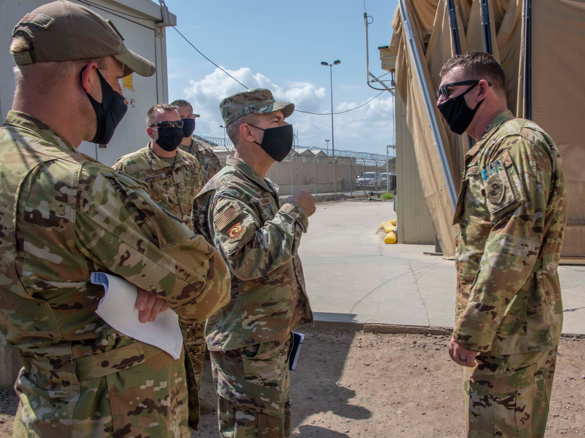 U.S. Air Force Gen. Jeffrey Harrigian, center, U.S. Air Forces in Europe and Air Forces Africa commander, meets with Air Force personnel, Jan. 5, 2020, at Camp Lemonnier, Djibouti. Harrigian recognized several Airmen for their contribution to the mission while touring the various facilities. (U.S. Air Force photo by Senior Airman Kristin Savage)