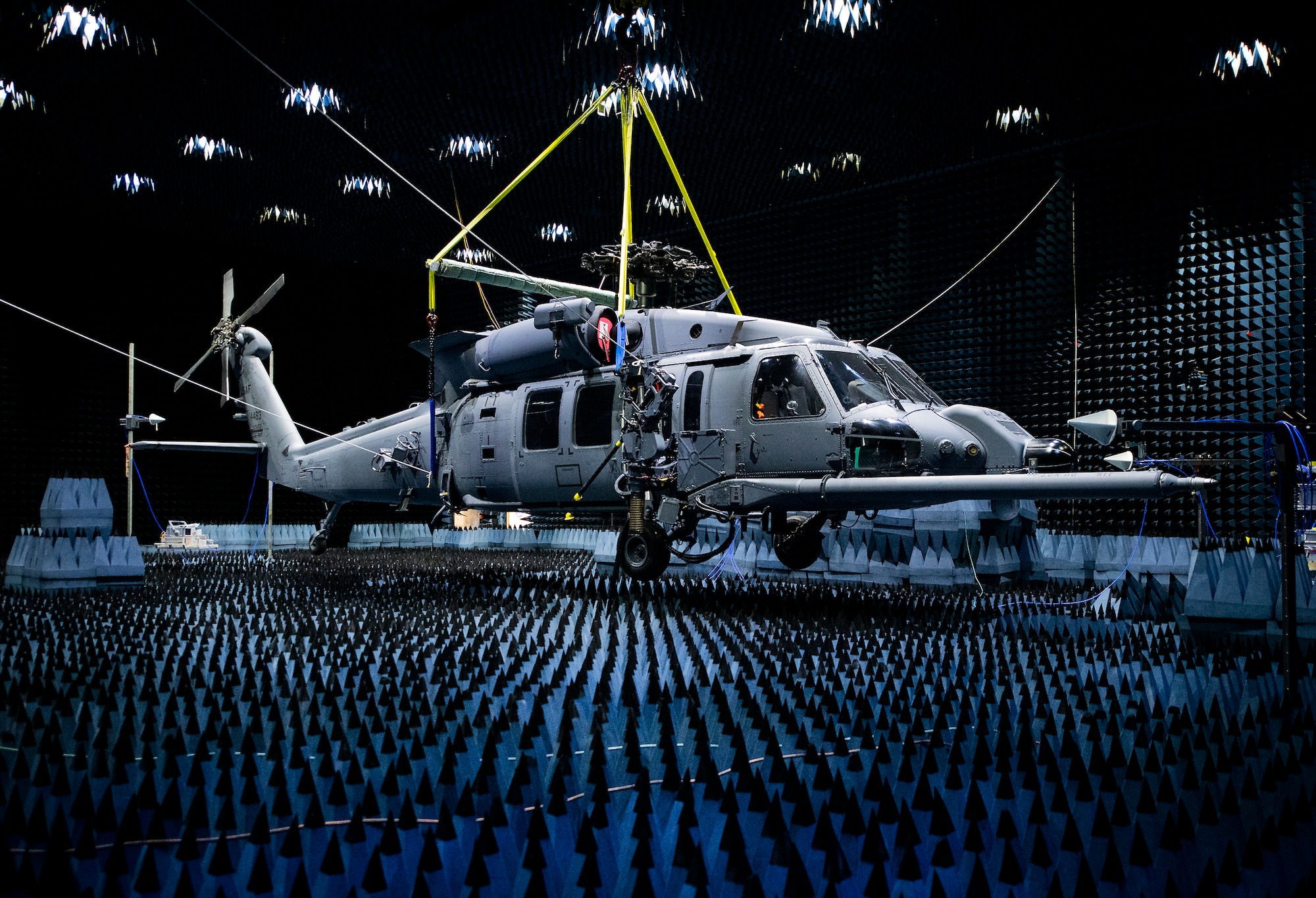 A 413th Flight Test Squadron HH-60W Pave Hawk hangs in the anechoic chamber at the Joint Preflight Integration of Munitions and Electronic Systems hangar, Jan. 6, 2020, at Eglin Air Force Base, Fla. The J-PRIMES anechoic chamber is a room designed to stop internal reflections of electromagnetic waves, as well as insulate from external sources of electromagnetic noise.