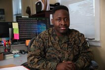 Lance Cpl. Muya M. Malenga, a administrative specialist/legal clerk with Head Quarters Company, 2d Marine Regiment, 2d Marine Division, poses for a photo on Camp Lejeune, N.C., January, 7, 2021. "Courage is not having the strength to go on, it is going on when you do not have the strength," said Malenga, a Las Vegas, NV, native. According to his leadership, Malenga has been an asset since his arrival. LCpl Malenga ensures his duties are completed to the best of his ability and takes personal pride in the quality of his work and attention to detail.  Although legal is one of the busiest sections within the S1, any time LCpl Malenga does have, he utilizes to ask questions and cross train with his peers in order to grow within his field.  As a result, he has been able to more efficiently track and process over 150 administrative separations, command investigations, NJPs, and courts martials.  LCpl Malenga is a trustworthy team player who is always ready and willing to cover down for his team in any capacity he is needed while maintaining an enthusiastic positive attitude and uplifting everyone around him. (U.S. Marine Corps photo by Lance Cpl. Jennifer E. Reyes)