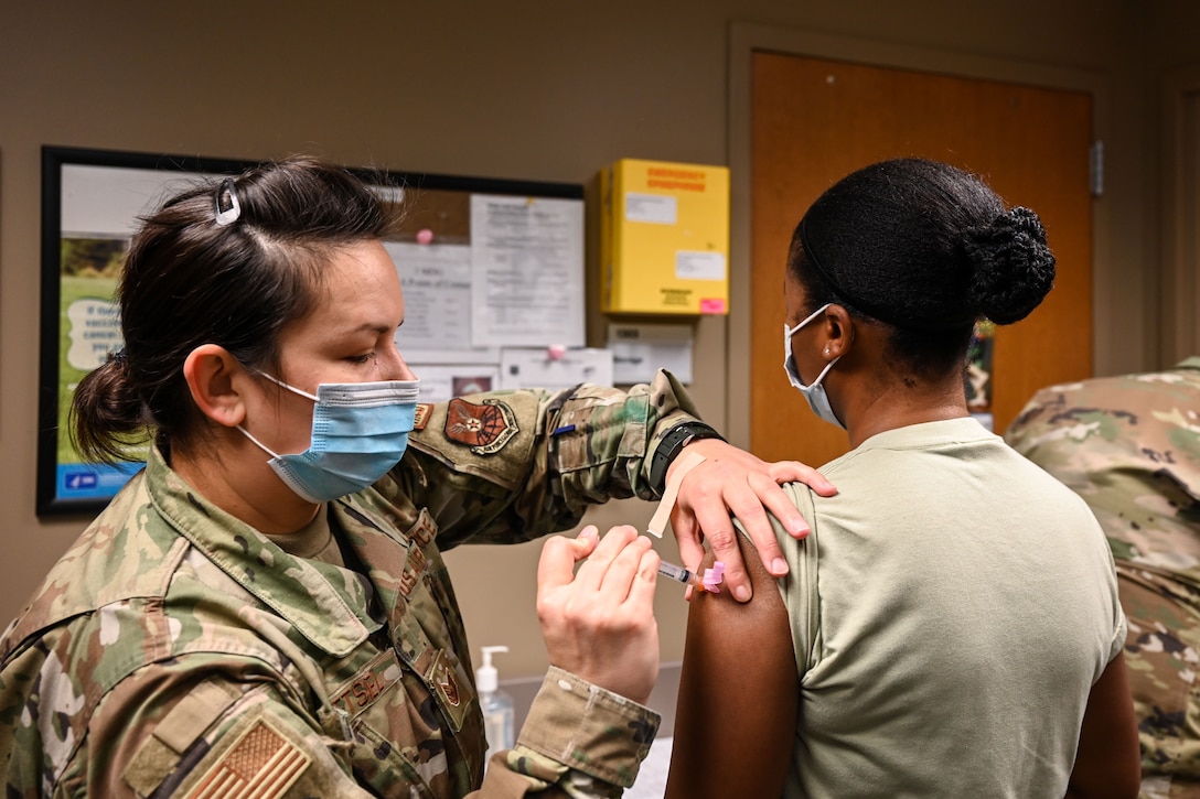 An airman gets vaccinated.
