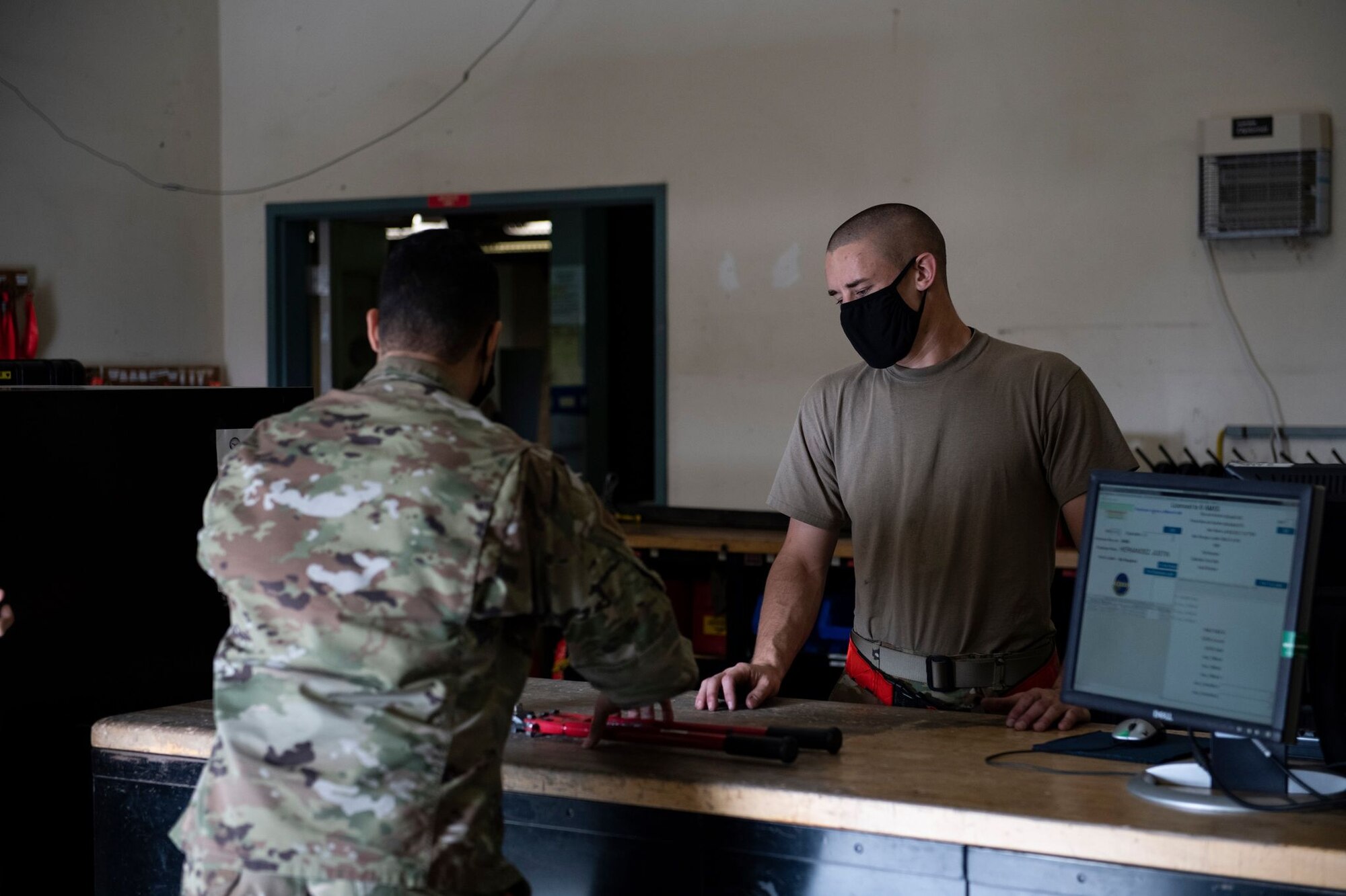 Tech. Sgt. Jared Karcher, 9th Aircraft Maintenance Squadron (AMXS) support section shift lead, right, checks out bolt cutters to a maintainer on Beale Air Force Base.