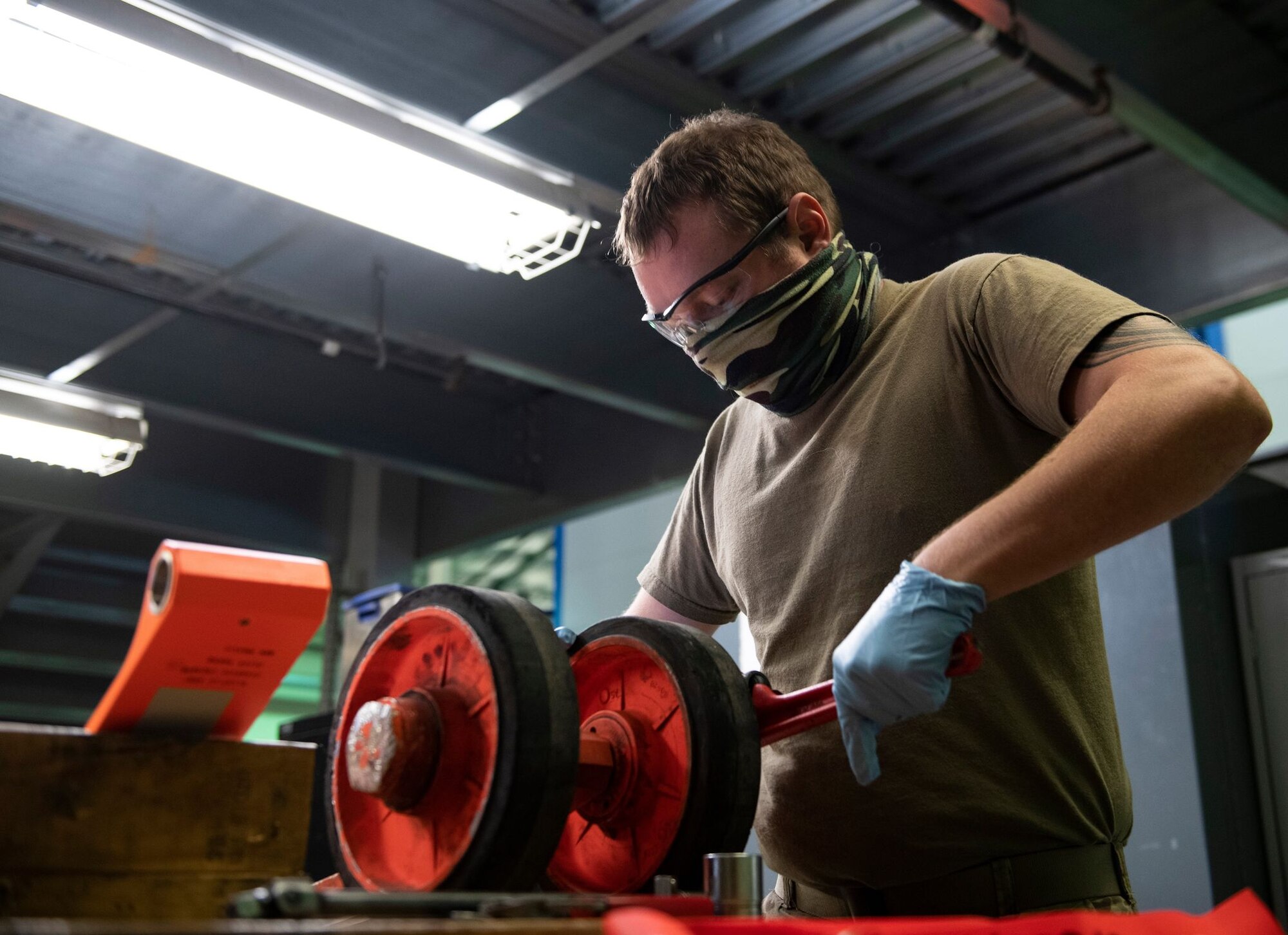 Senior Airman Adam Sherman, 9th Aircraft Maintenance Squadron (AMXS) support technician, removes the wheels of a U-2 Dragon Lady pogo-wheel assembly on Beale Air Force Base.
