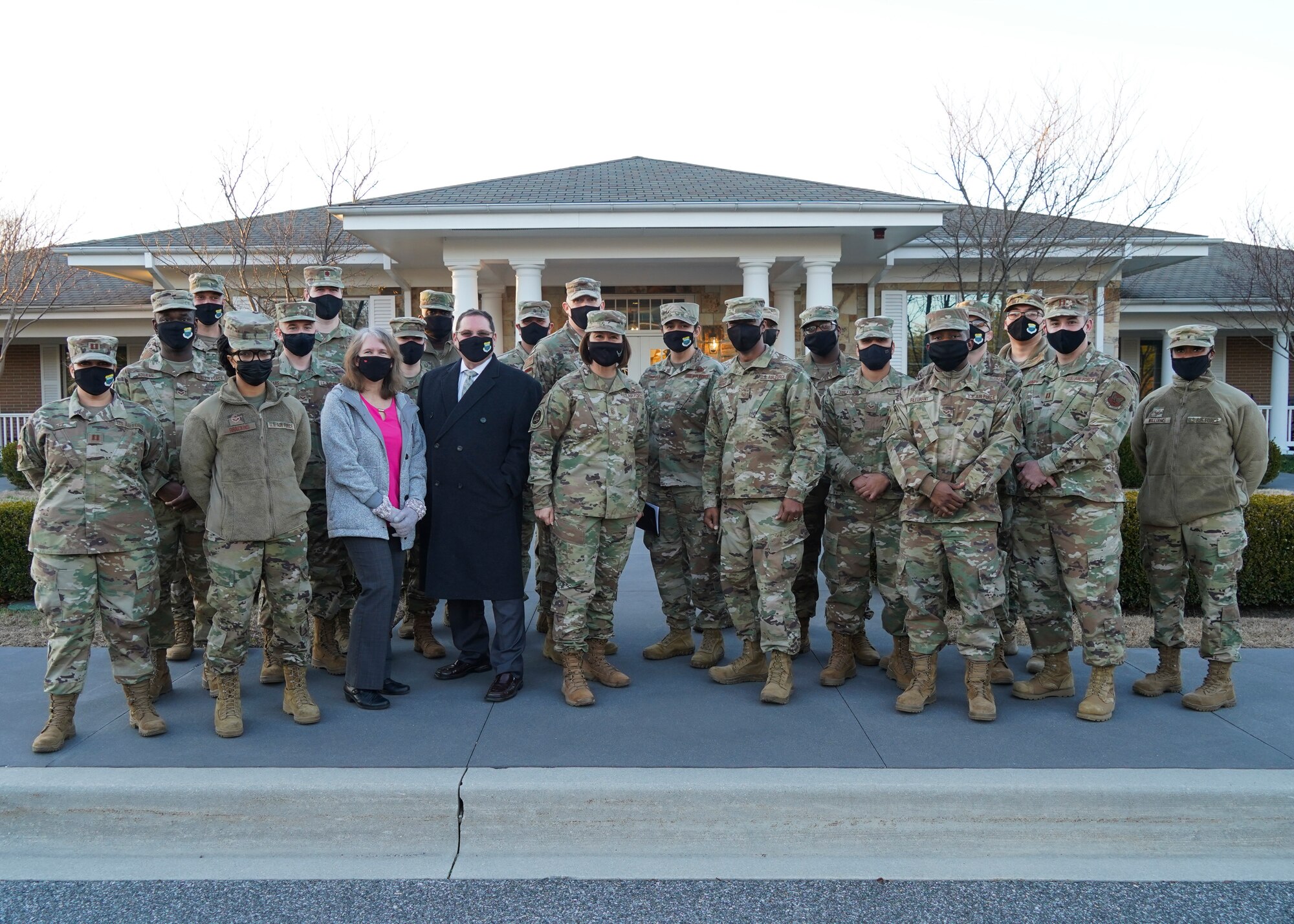 Chief Master Sgt. of the Air Force JoAnne Bass poses for a photo with a team from Air Force Mortuary Affairs Operations at Dover Air Force Base, Delaware, Jan. 7, 2021. The office of the Chief Master Sergeant of the Air Force represents the highest enlisted level of leadership, provides direction for the enlisted corps and represents their interests to the American public and all levels of government. (U.S. Air Force photo by Senior Airman Alyssa Day)