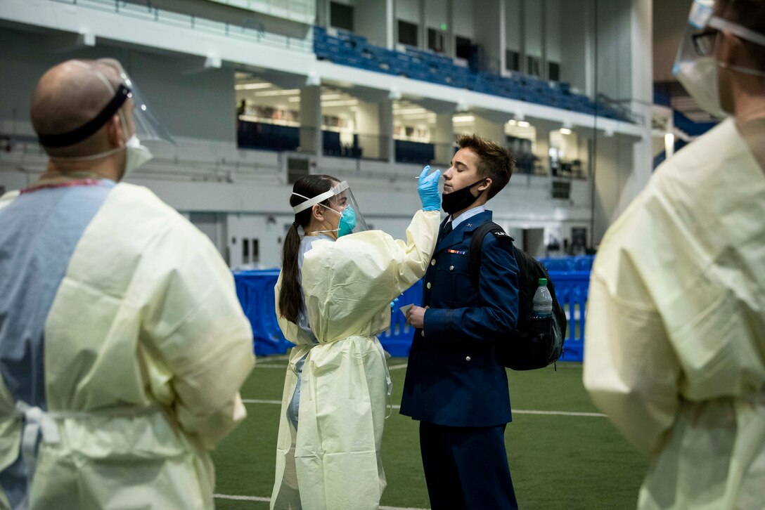 U.S. Air Force Academy cadets returning from winter break receive a rapid result COVID-19 test before entering a restriction of movement phase to start the semester in Colorado Springs, Colo., Jan. 5, 2021.
