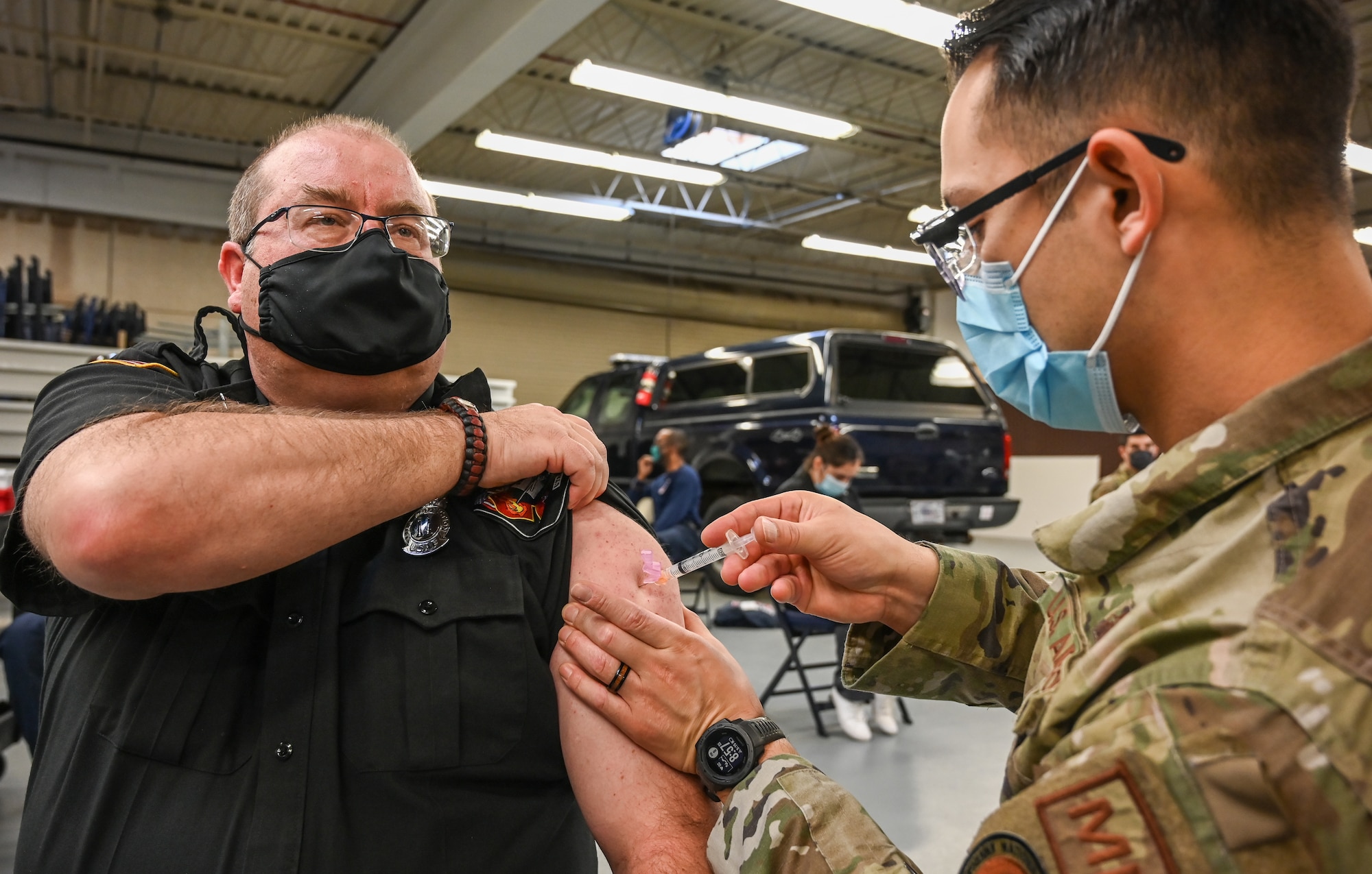 Virgil Jones, 775th Civil Engineer Squadron fire chief, receives his COVID-19 vaccination.