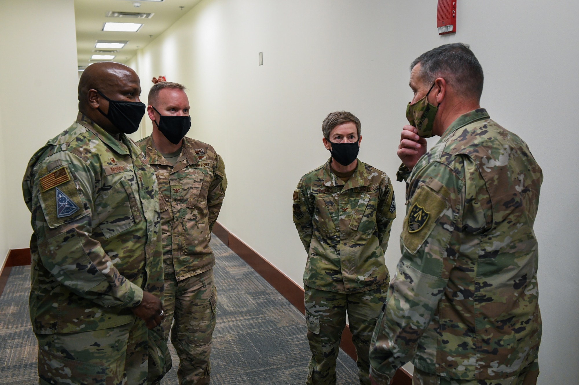 From left to right, U.S. Air Force Col. Devin Pepper, Buckley Garrison commander, U.S. Air Force Col. Brian Chellgren, 460th Mission Support Group commander, U.S. Air Force Col. Shannon Phares, 460th Medical Group commander, and U.S. Army Gen. James Dickinson, U.S. Space Command commander, are introduced following a mission brief in the Buckley Garrison headquarters building on Buckley Air Force Base, Colo., Jan. 7, 2021.