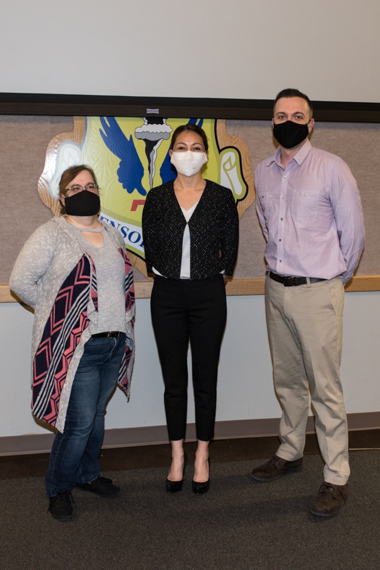 Tina Shelnut, Ohio State University Airman’s Edge research associate, AnnaBelle Bryan, Ohio State University director and clinical research manager, and Dr. Justin Baker, Ohio State University Department of Psychiatry & Behavioral Health assistant professor of research, stand for photo at Whiteman Air Force Base, Missouri, Dec. 16, 2020. Airman’s Edge helps Airmen by teaching several emotion regulation and cognitive flexibility skills including relaxation, mindfulness, cognitive reappraisal, and sleep behaviors. (U.S. Air Force photo by Airman 1st Class Christina Carter)