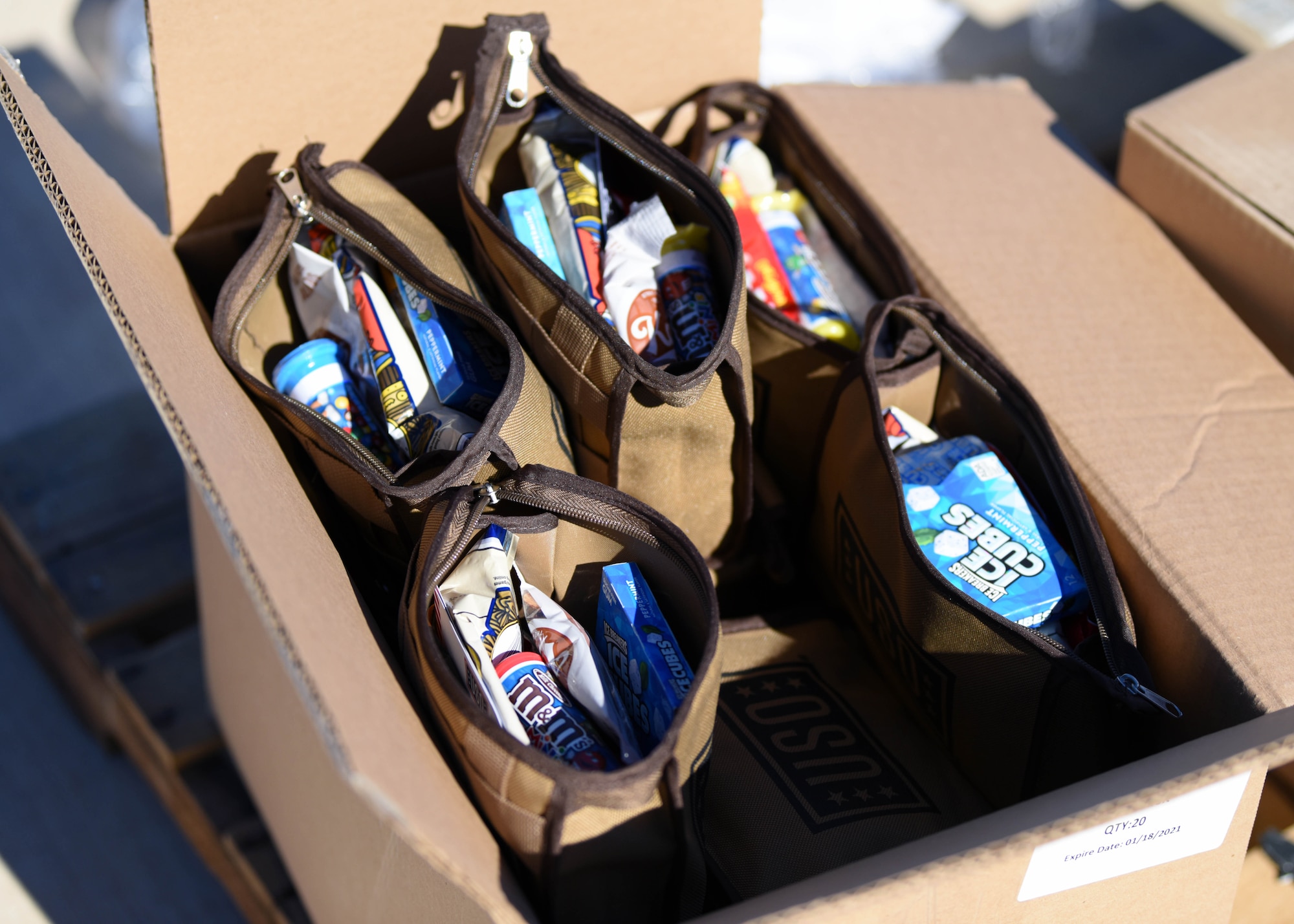 Snack packs donated from the USO sit on display before being handed out by volunteers at the Cressman Dining Facility on Goodfellow Air Force Base, Texas, Jan. 7, 2021. The USO is a non-profit organization dedicated to serving the men and women in the U.S. military through donations, entertainment, or support for families. (U.S. Air Force photo by Airman 1st Class Ethan Sherwood)