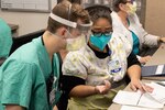 Photo of nurses assigned to Travis Air Force Base, Calif., working side-by-side with the medical staff at Dameron Hospital.