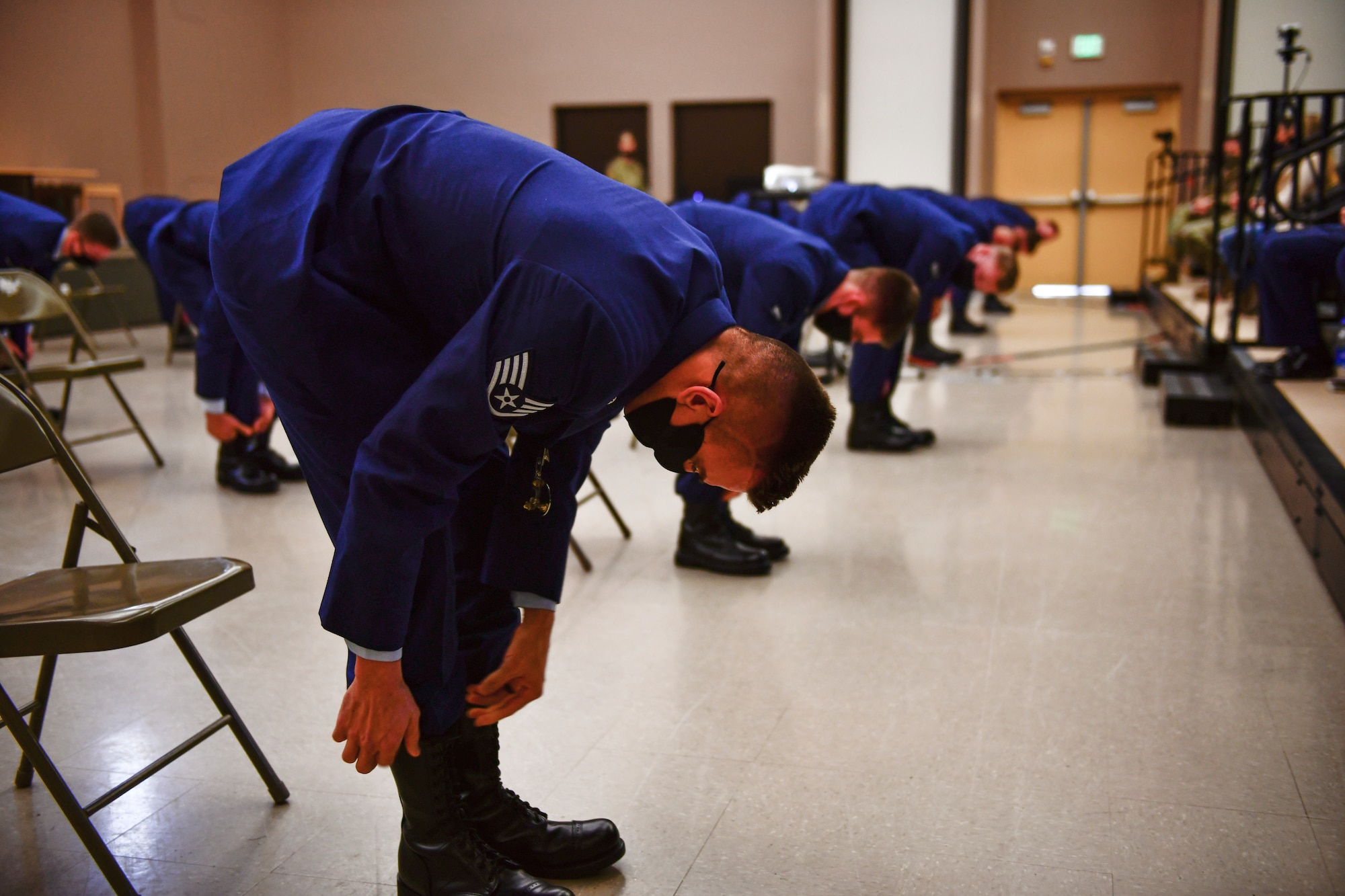 U.S. Air Force 66th Training Squadron Survival, Evasion, Resistance and Escape Specialist Course graduates blouse their boots upon completing the SERE Specialist Apprentice Course at Fairchild Air Force Base, Washington, January 8, 2021. Prior to becoming SERE specialists, candidates go through a strenuous six-month training pipeline where normal attrition rates average about 50 percent due to the rigorous nature of the training. (U.S. Air Force photo by Senior Airman Ryan Gomez)