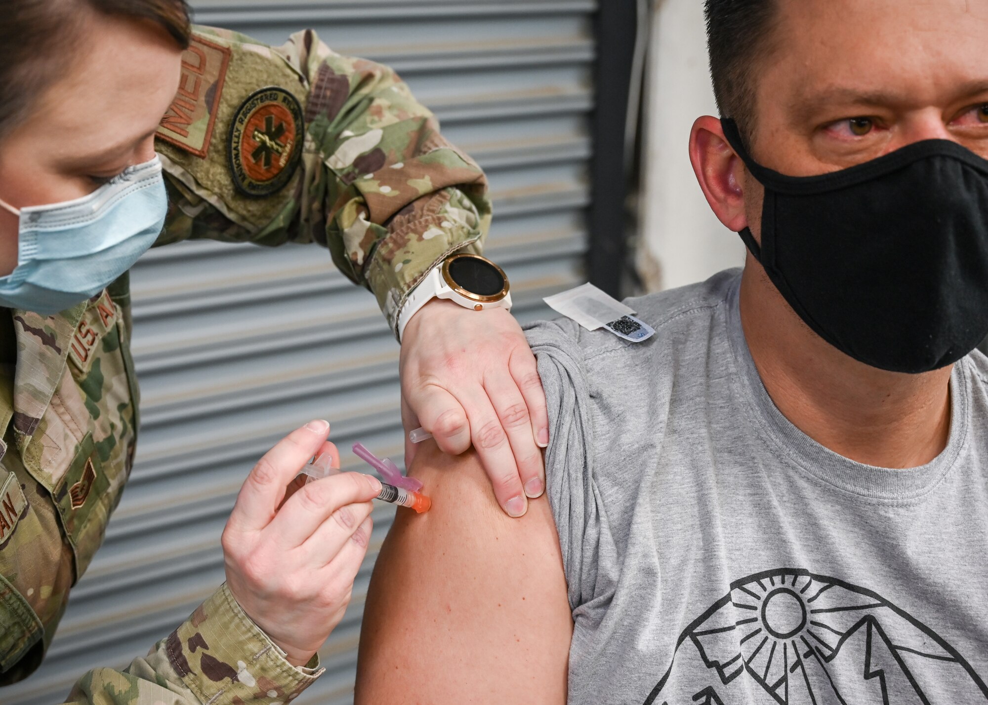 Aaron Butler, 775th Civil Engineering Squadron, receives his COVID-19 vaccination.