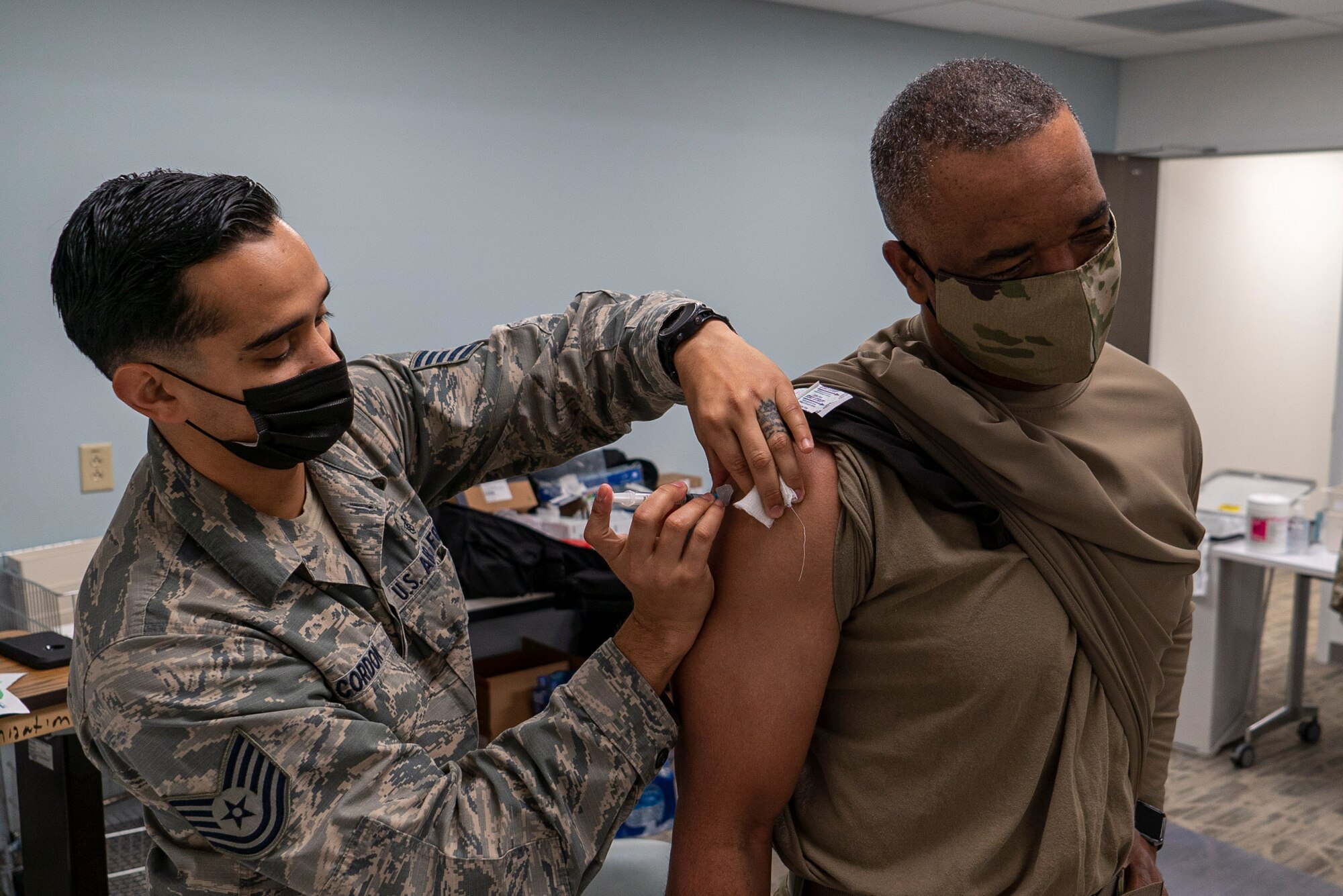U.S. Air Force Reserve Technical Sgt. Franklin Cordon a medical technician with the 78th Healthcare Operations Squadron, administers the Covid-19 vaccine to Chief Master Sgt. Timothy White, senior enlisted advisor to the chief of the Air Force Reserve and command chief, Air Force Reserve Command, January 8th, 2021 at Robins Air Force Base, GA. (US Air Force photo by Technical Sgt. Nicholas A. Priest)
