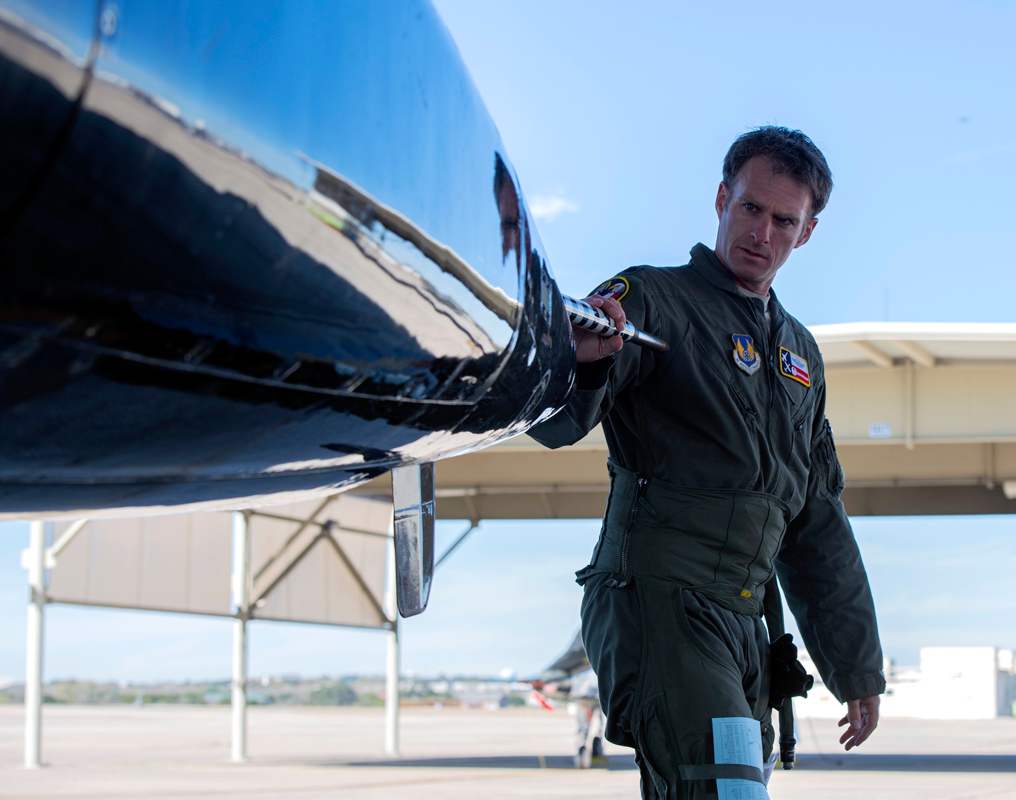 U. S. Air Force Lt. Col. Andrew Williams, 415th Flight Test Flight commander, inspects a T-38 before its test flight at Joint Base San Antonio-Randolph Dec. 1, 2020.