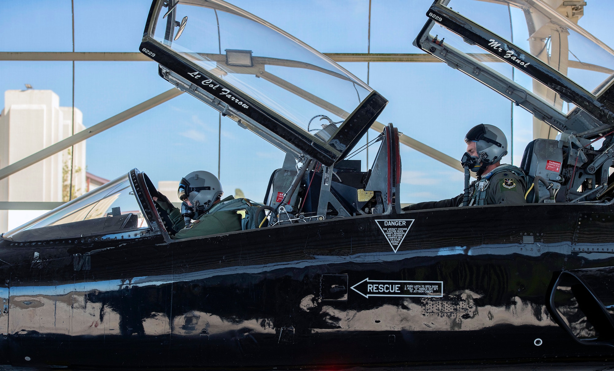 U. S. Air Force Maj. Bede Bolin, T-38 Talon command chief pilot, left, and Lt. Col. Andrew Williams, commander, right, both assigned to the 415th Flight Test Flight, prepare for a test flight at Joint Base San Antonio-Randolph, Dec. 1, 2020.