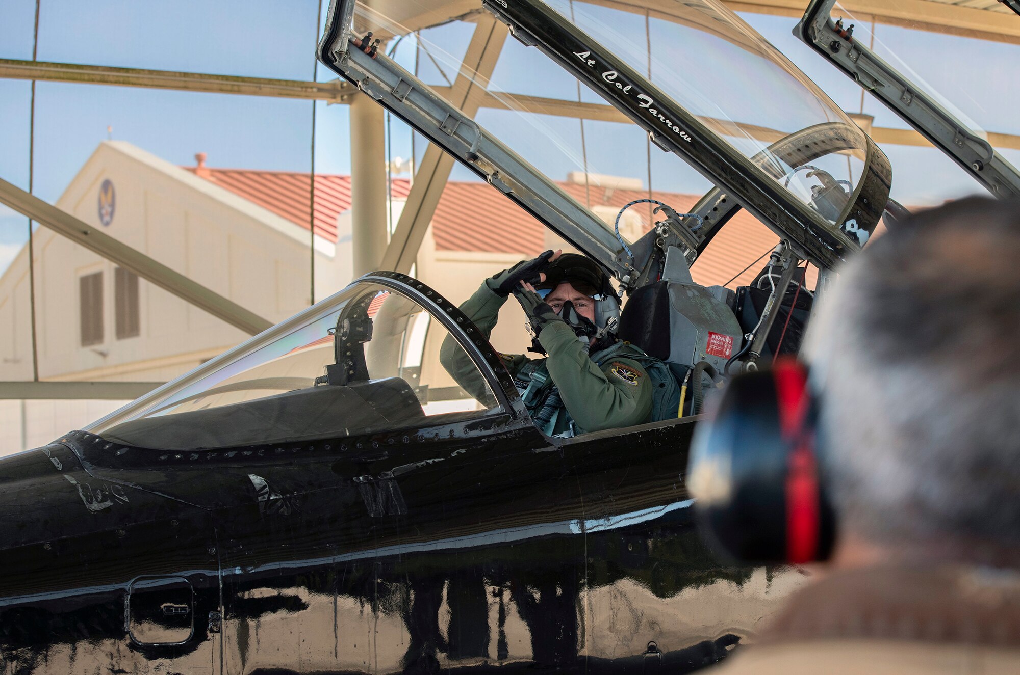 U. S. Air Force Maj. Bede Bolin, 415th Flight Test Flight T-38 command chief pilot, communicates with maintenance crew members before a test flight at Joint Base San Antonio-Randolph, Dec. 1, 2020.