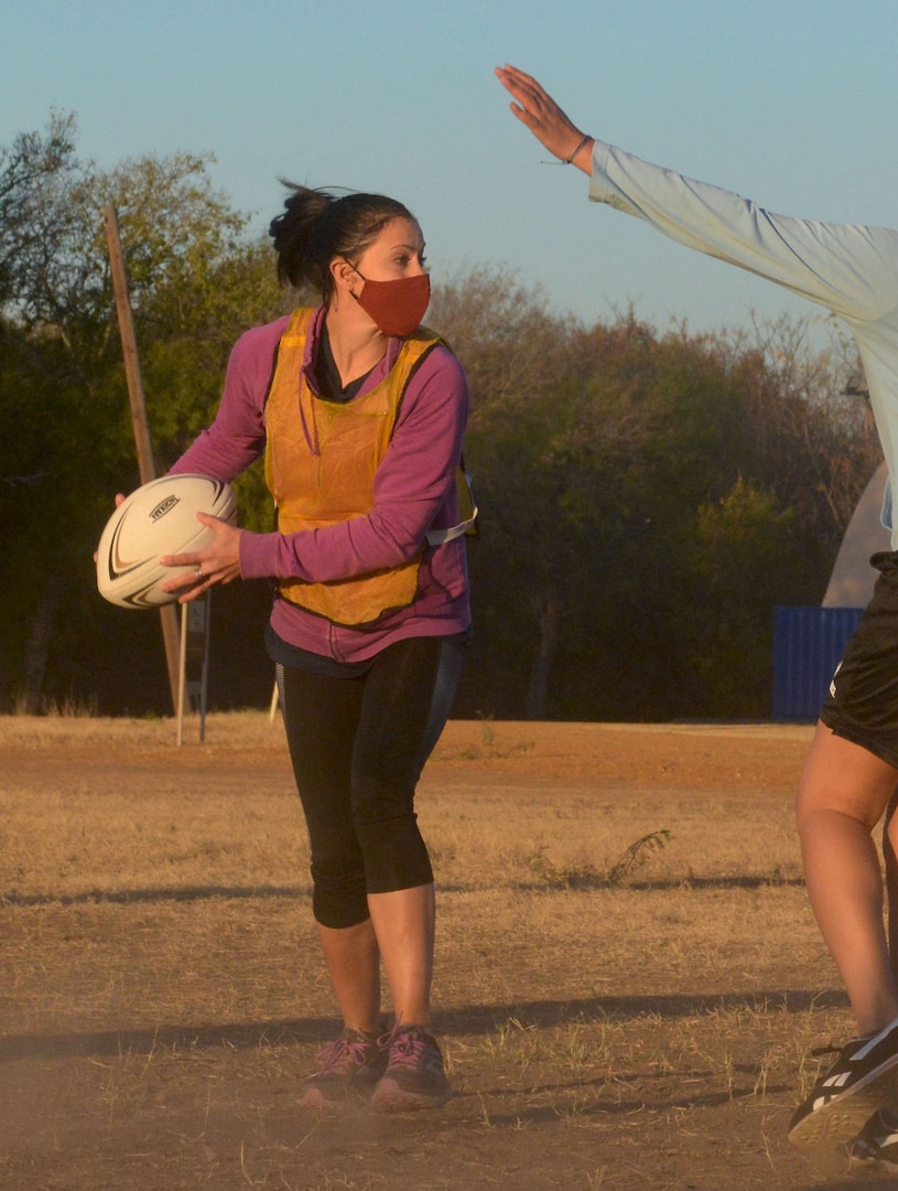 Master Sgt. Julie Coulter, 426th Network Warfare Squadron first sergeant, plays rugby in a team building exercise with other attendees of the 960th Cyberspace Wing leadership summit Nov. 17, 2020, at Joint Base San Antonio-Chapman Training Annex, Texas. (U.S. Air Force photo by Samantha Mathison)