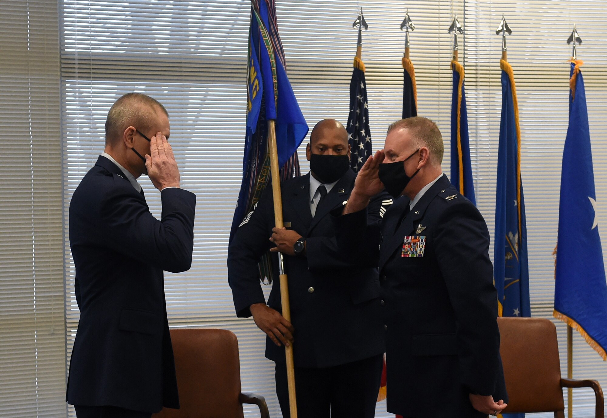 Gen. Shawn D. Ford (left) and Col. Travis J. Crawmer (right) pose for photos during the 132d Wing's Change of Command (CoC) Ceremony at the 132d Wing on January 9, 2021. Col. Mark A. Chidley relinquished command to Col. Crawmer, the CoC was presided over by Gen. Ford.