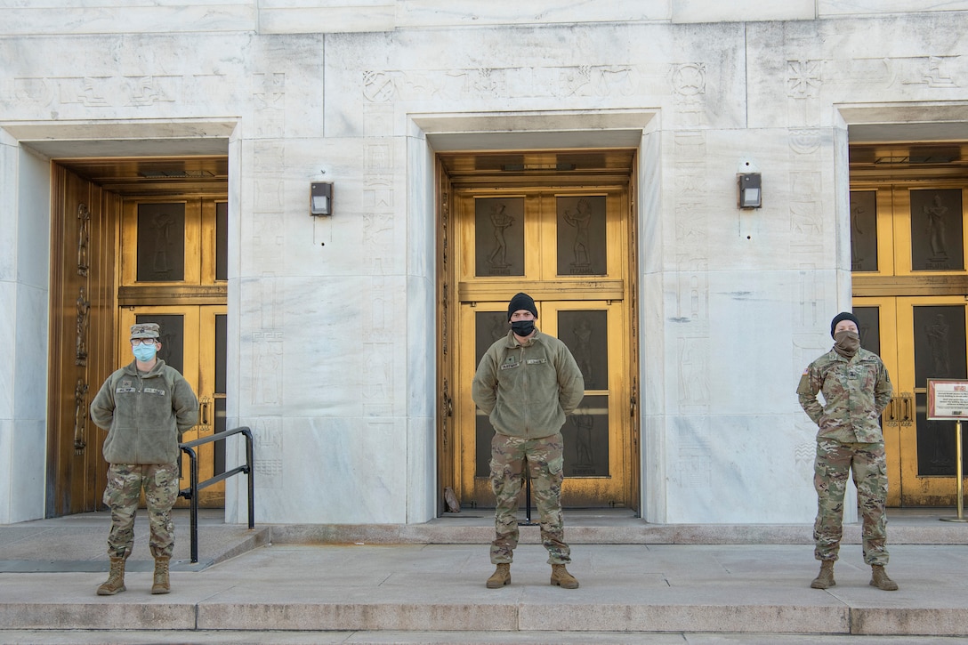 Virginia National Guard Soldiers assigned to the 229th Military Police Company, 529th Combat Sustainment Support Battalion, 329th Regional Support Group, stand guard at their post Jan. 9, 2021, in Washington, D.C.. National Guard Soldiers and Airmen from several states have traveled to the National Capital Region to provide support to federal and district authorities leading up to the 59th Presidential Inauguration. (U.S. Air National Guard photo by Tech. Sgt. Lucretia Cunningham)