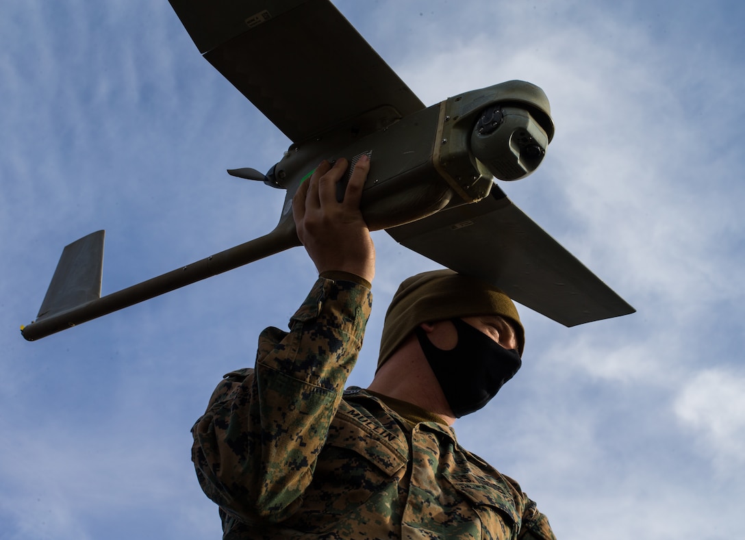 GySgt. Edward Mullin, an intelligence chief with 3d Battalion, 8th Marines, demonstrates the use of an aerial ISR platform