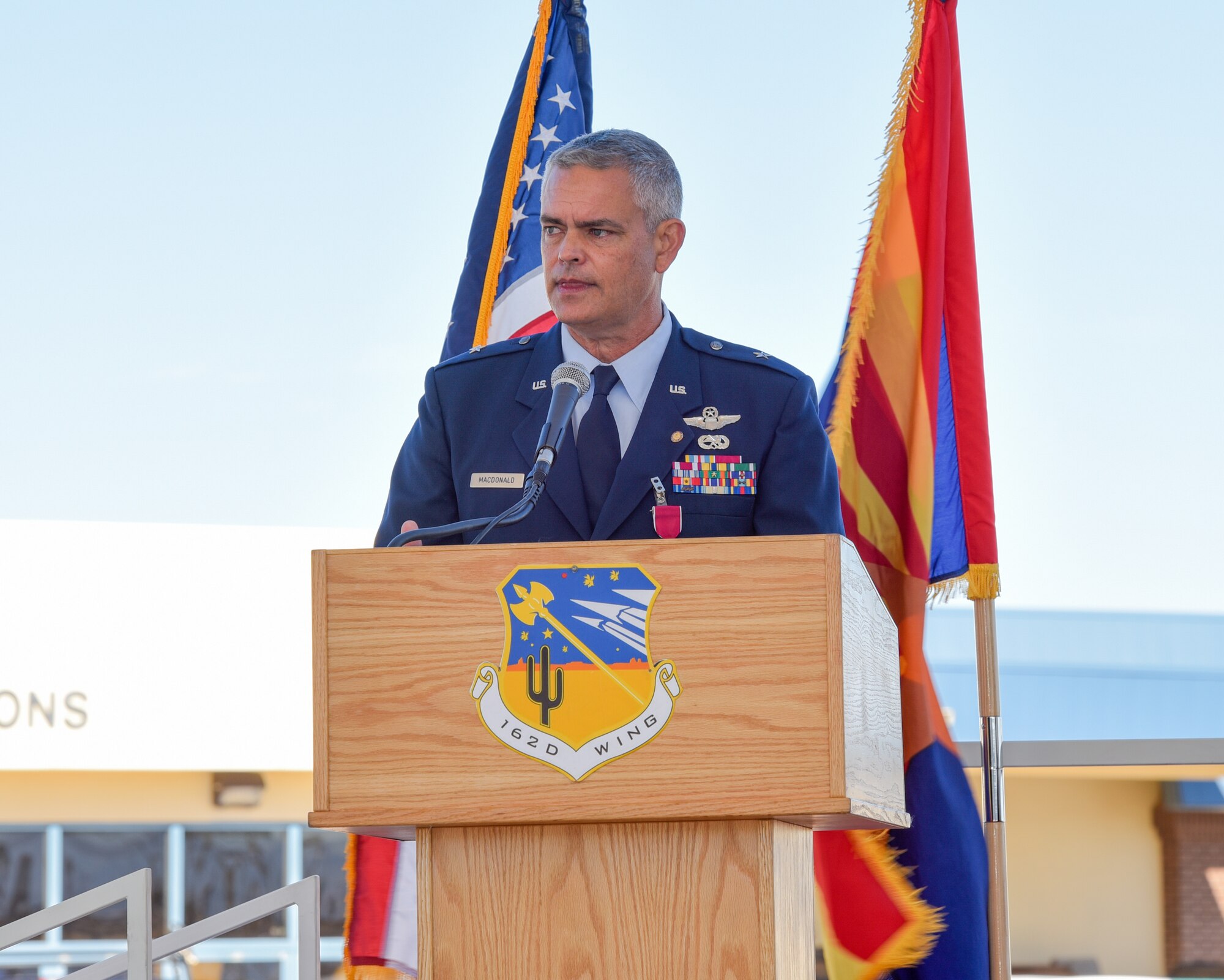 The 162nd Wing Arizona Air National Guard honored the retirement of its former wing commander Brig. Gen. Andrew MacDonald in a unique ceremony Jan. 10 at the Morris Air National Guard Base. Due to the COVID-19 pandemic, the wing held a ceremony for MacDonald’s retirement by limiting attendance to family and distinguished guests, in person, while live-streaming the event to members across base. (U.S. Air National Guard Photo by Staff Sgt. Aubrey Pomares/Released)