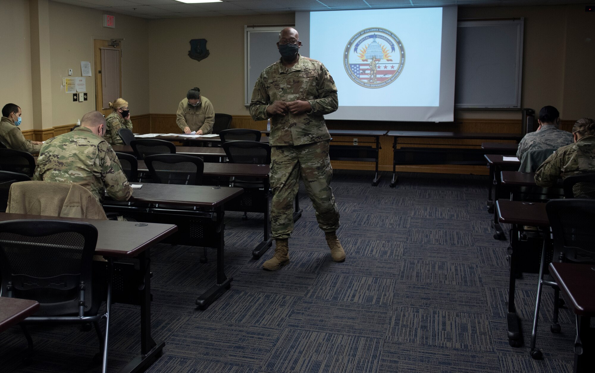 Master Sgt. Gary Sills from the 108th Wing finance office addresses Guardsmen Jan. 9, 2021, at Joint Base McGuire-Dix-Lakehurst, N.J., prior to their departure to the National Capital Region. National Guard Soldiers and Airmen from several states have traveled to the NCR to provide civil disturbance support to federal and district authorities.