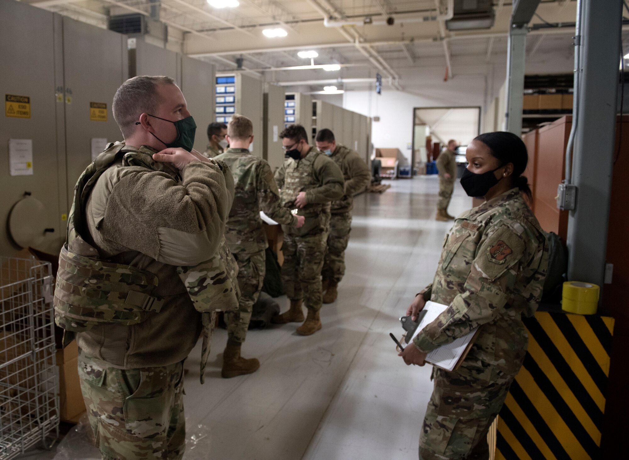 Capt. Reilly Nuckel, commander of the 108th Wing’s vehicle management flight, dons protective gear Jan. 9, 2021, at Joint Base McGuire-Dix-Lakehurst N.J. National Guard Soldiers and Airmen from several states have traveled to the National Capital Region to provide civil disturbance support to federal and district authorities.