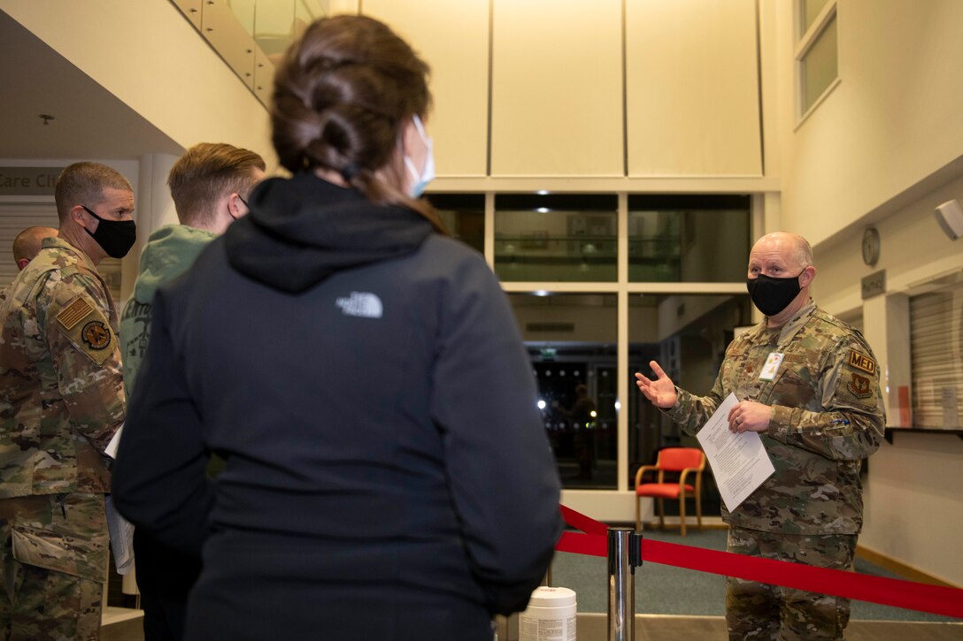 U.S. Air Force Maj. Richard Gray, right, 501st Combat Support Wing chief of medical staff, informs 423rd Security Forces Squadron Airmen about the COVID-19 vaccine prior to its administration at Royal Air Force Alconbury, England, Jan. 5, 2021. 501st CSW first responders were prioritized to receive the vaccine based on the guidance from the Centers for Disease Control and Prevention as well as the DoD COVID Task Force’s assessment of unique DoD mission requirements. (U.S. Air Force photo by Senior Airman Jennifer Zima)