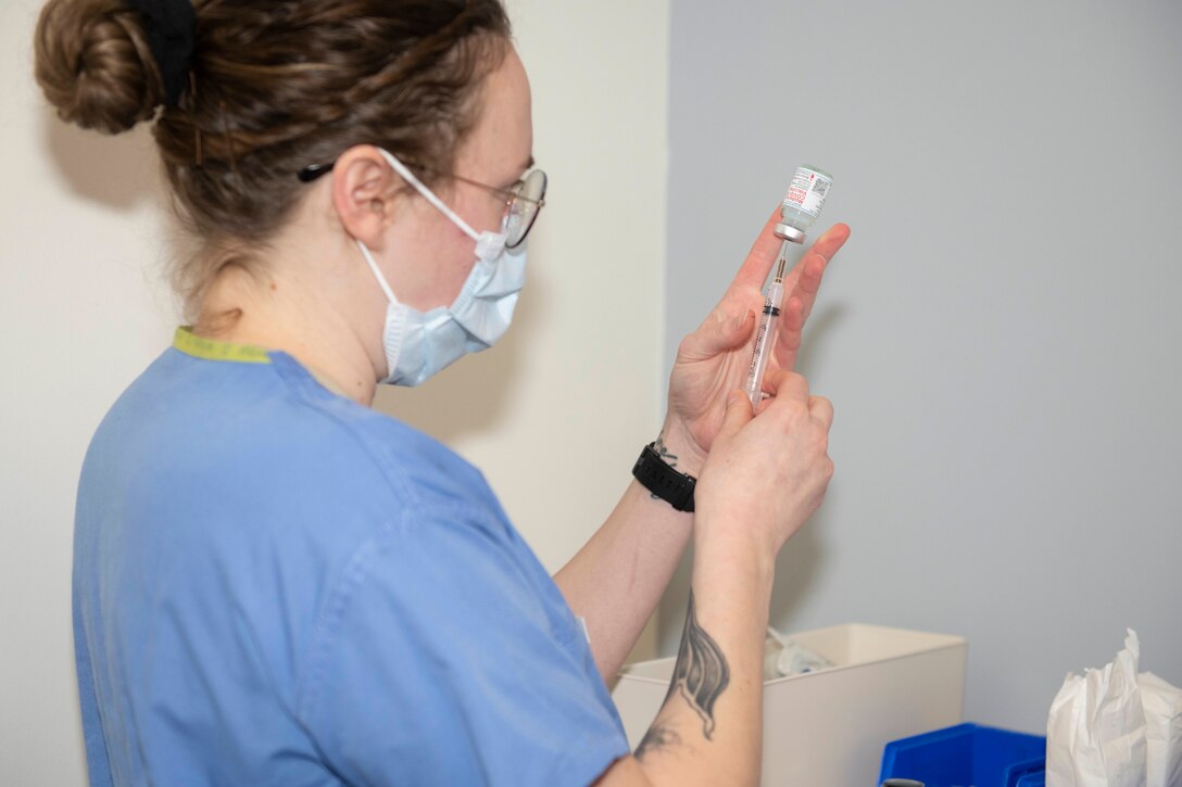 U. S. Air Force Staff Sgt. Morgan Mack, 423rd Medical Squadron noncommissioned officer in charge of immunization, prepares to administer the COVID-19 vaccine at Royal Air Force Alconbury, England, Jan. 5, 2021. 501st Combat Support Wing first responders were prioritized to receive the vaccine based on the guidance from the Centers for Disease Control and Prevention as well as the DoD COVID Task Force’s assessment of unique DoD mission requirements. (U.S. Air Force photo by Senior Airman Jennifer Zima)