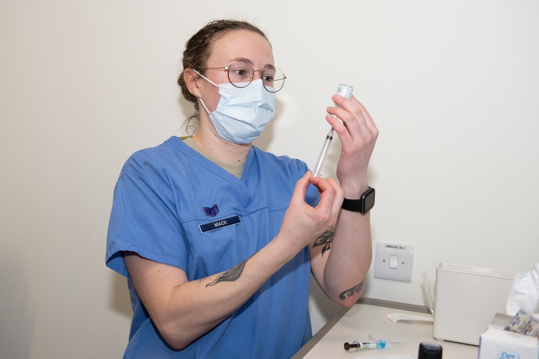 U. S. Air Force Staff Sgt. Morgan Mack, 423rd Medical Squadron noncommissioned officer in charge of immunization, prepares to administer the COVID-19 vaccine at Royal Air Force Alconbury, England, Jan. 5, 2021. 501st Combat Support Wing first responders were prioritized to receive the vaccine based on the guidance from the Centers for Disease Control and Prevention as well as the DoD COVID Task Force’s assessment of unique DoD mission requirements. (U.S. Air Force photo by Senior Airman Jennifer Zima)