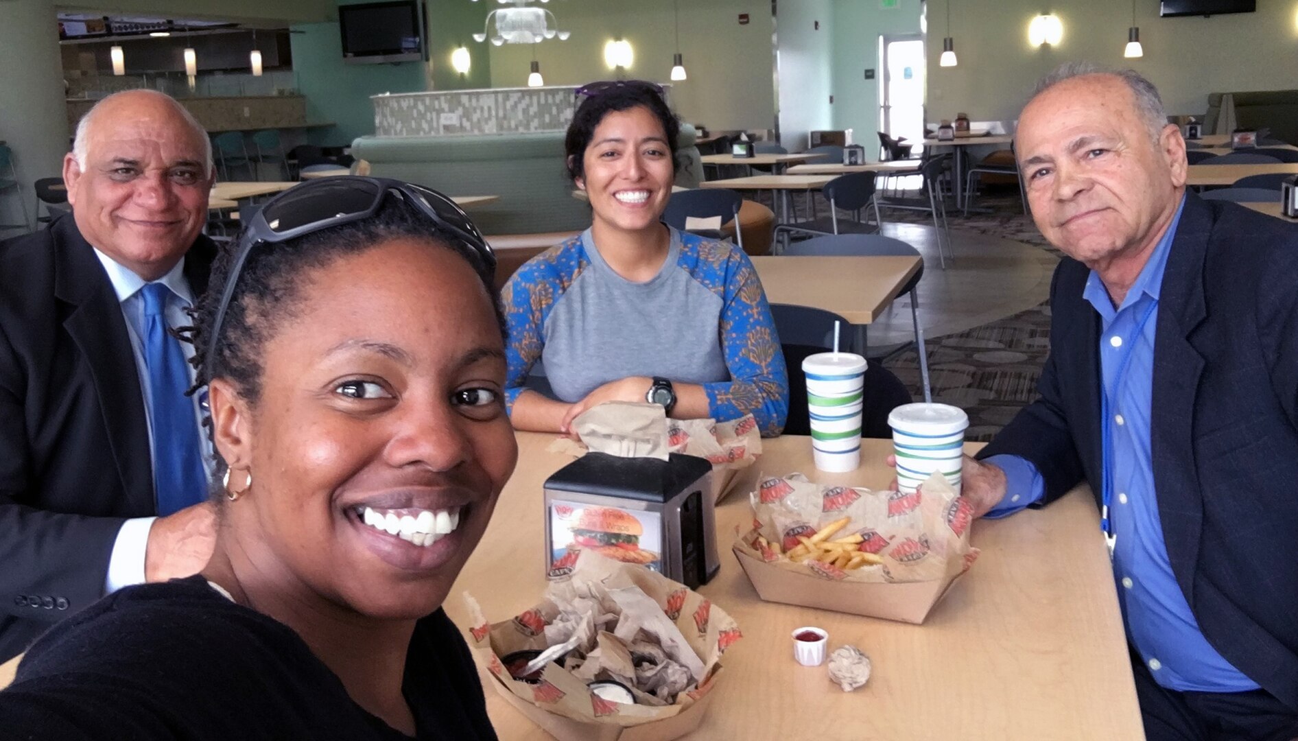 Air Force Capt. Victoria Villa (center, back) enjoys lunch with a Language Enabled Airman Program classmate and instructors from Defense Language Institute Foreign Language Center in Monterey, California, 2017.