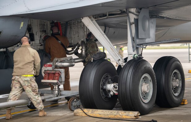 Members of the 100th Maintenance Group begin to refuel U.S. Air Force KC-135 Stratotanker aircraft assigned to the 100th Air Refueling Wing during the first-ever “hot-pit refuel” of a KC-135 Stratotanker aircraft in all of U.S. Air Forces in Europe command at Royal Air Force Mildenhall, Jan. 8 2021. “Hot-pit refueling,” is another name for an engine-running refuel while the aircraft is grounded which will save time while securing persistent operations by significantly reducing generation times. (U.S. Air Force photo by Tech. Sgt. Emerson Nuñez)