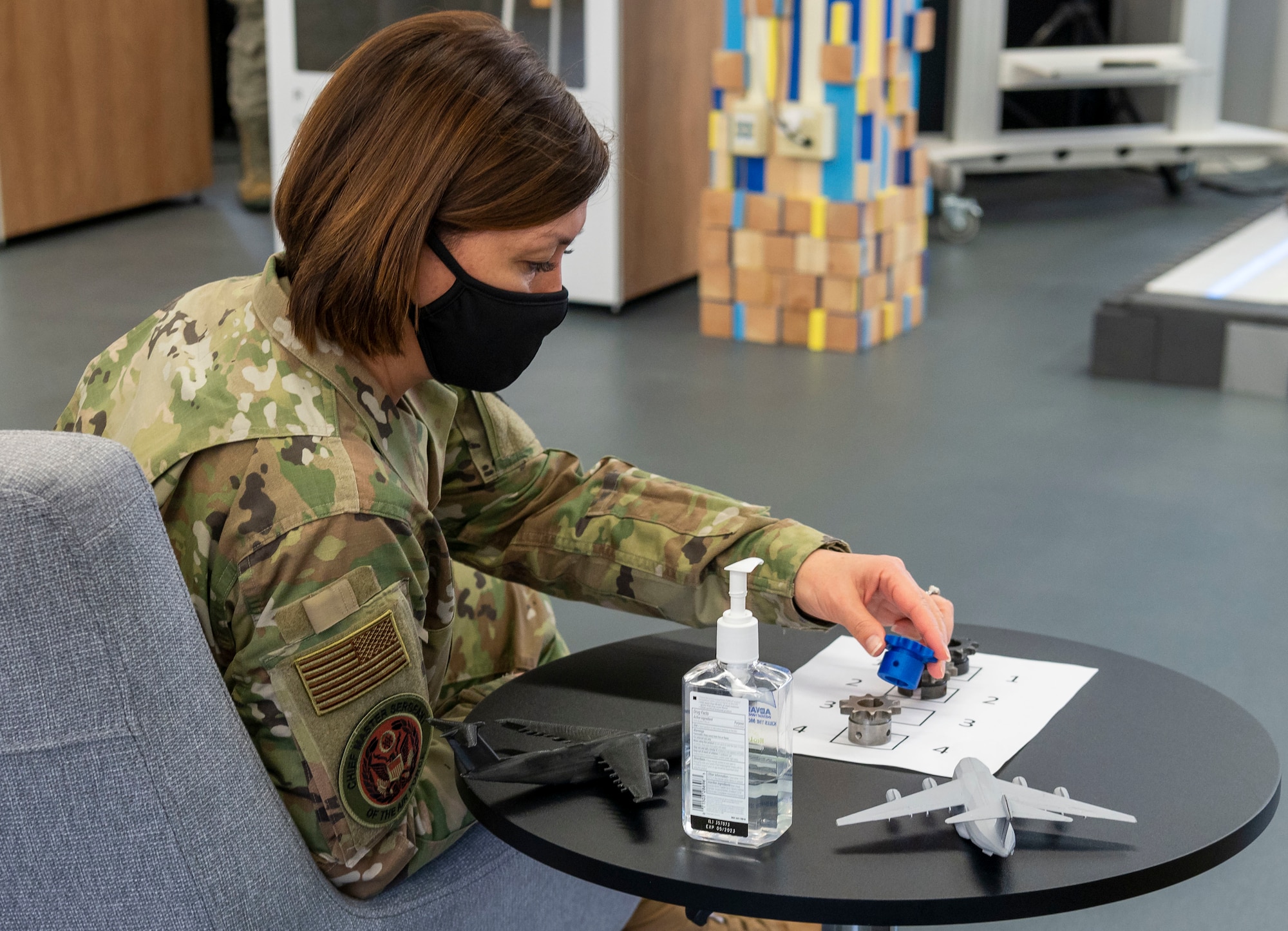 Chief Master Sgt. of the Air Force JoAnne S. Bass inspects a sprocket designed to solve a maintenance issue affecting refueling trucks Jan. 8, 2021, at the Bedrock innovation lab on Dover Air Force Base, Delaware. Designs like this are developed at Bedrock’s facilities where Airmen are empowered to collaborate and innovate new technologies. (U.S. Air Force photo by Senior Airman Christopher Quail)