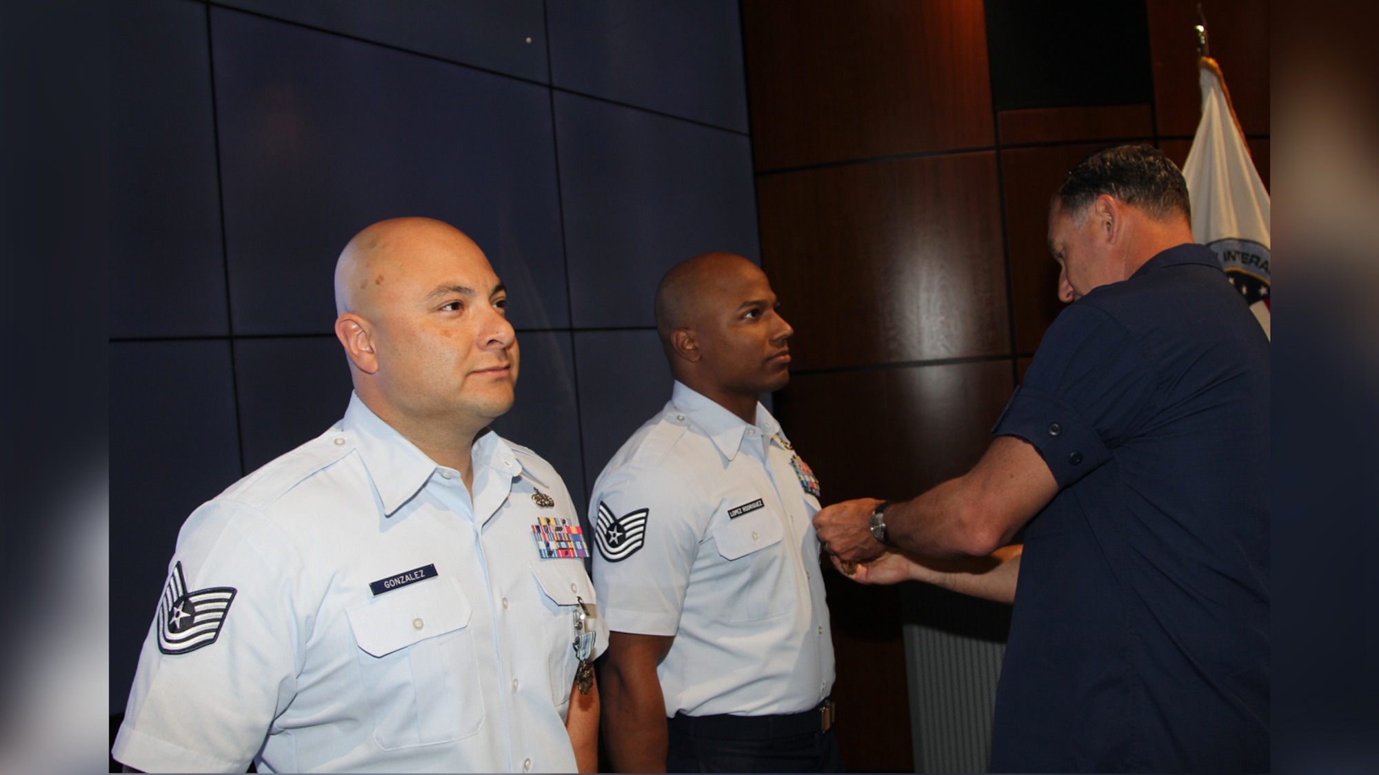 Pictured from left is Tech. Sgt. Edwin Lenis Gonzalez and Tech. Sgt. Jose Lopez Rodriguez received the Joint Service Achievement Medal from Coast Guard Rear Adm. Pat DeQuattro. (Courtesy photo)