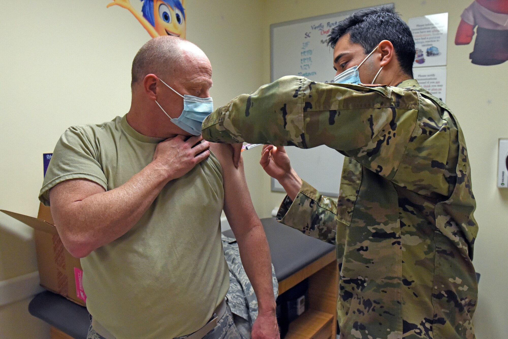 Staff Sgt. Daniel Contreras, a medical technician in the 419th Medical Squadron, administers a COVID-19 vaccine to Lt. Col. Brent Milne, a dentist in the MDS, Jan. 9, 2021, at Hill Air Force Base, Utah. Milne is one of the first reservists in the 419th Fighter Wing to receive the COVID-19 vaccine.