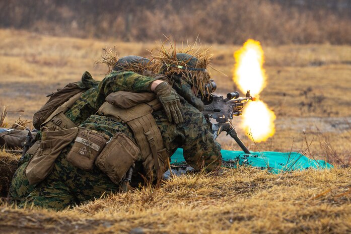 U.S. Marines lay down fire during a live-fire range in the Niigata Prefecture, Japan, Dec. 8.
